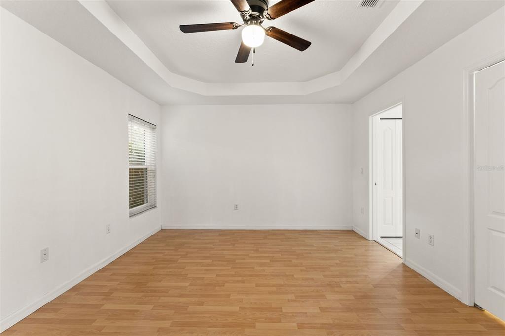 542 Fairbanks Road Spring Hill, FL 34608 - Photo 25 of 45 wooden floor in an empty room with a window