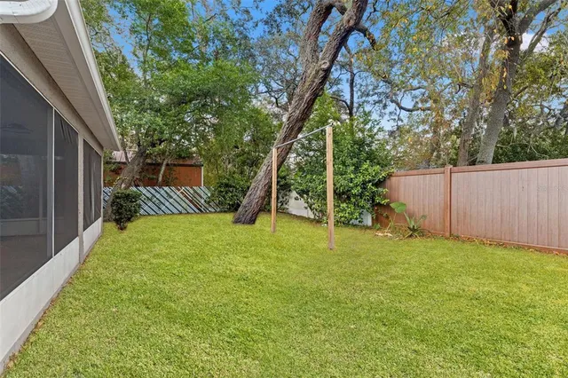 an aerial view of a house with a swimming pool