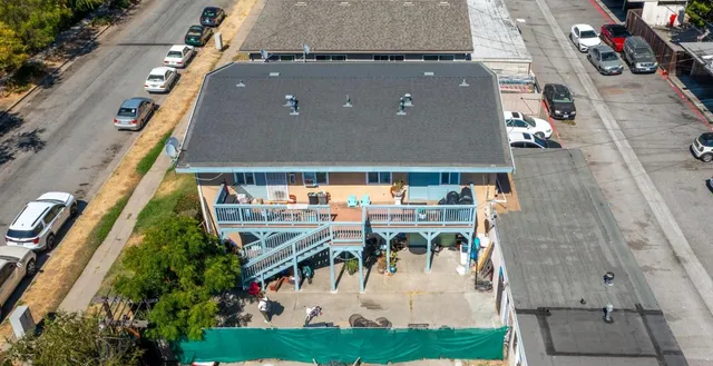 an aerial view of house with yard swimming pool and outdoor seating