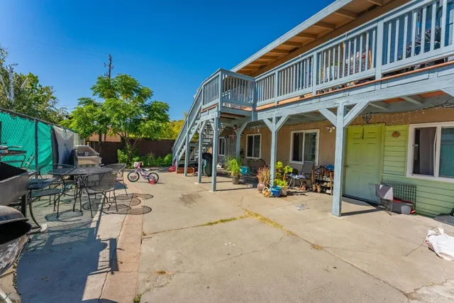 a view of a house with sitting area and furniture