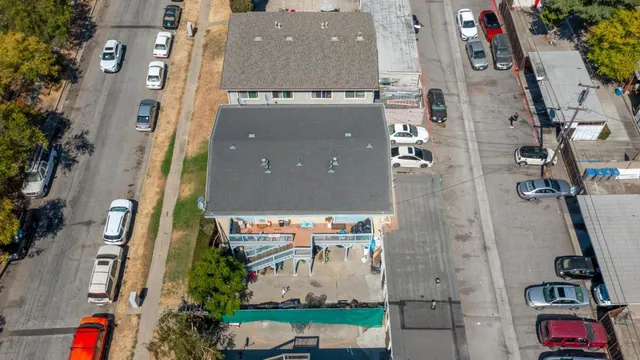 an aerial view of houses with outdoor space