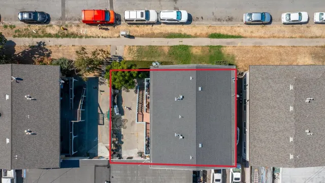 an aerial view of a houses with outdoor space