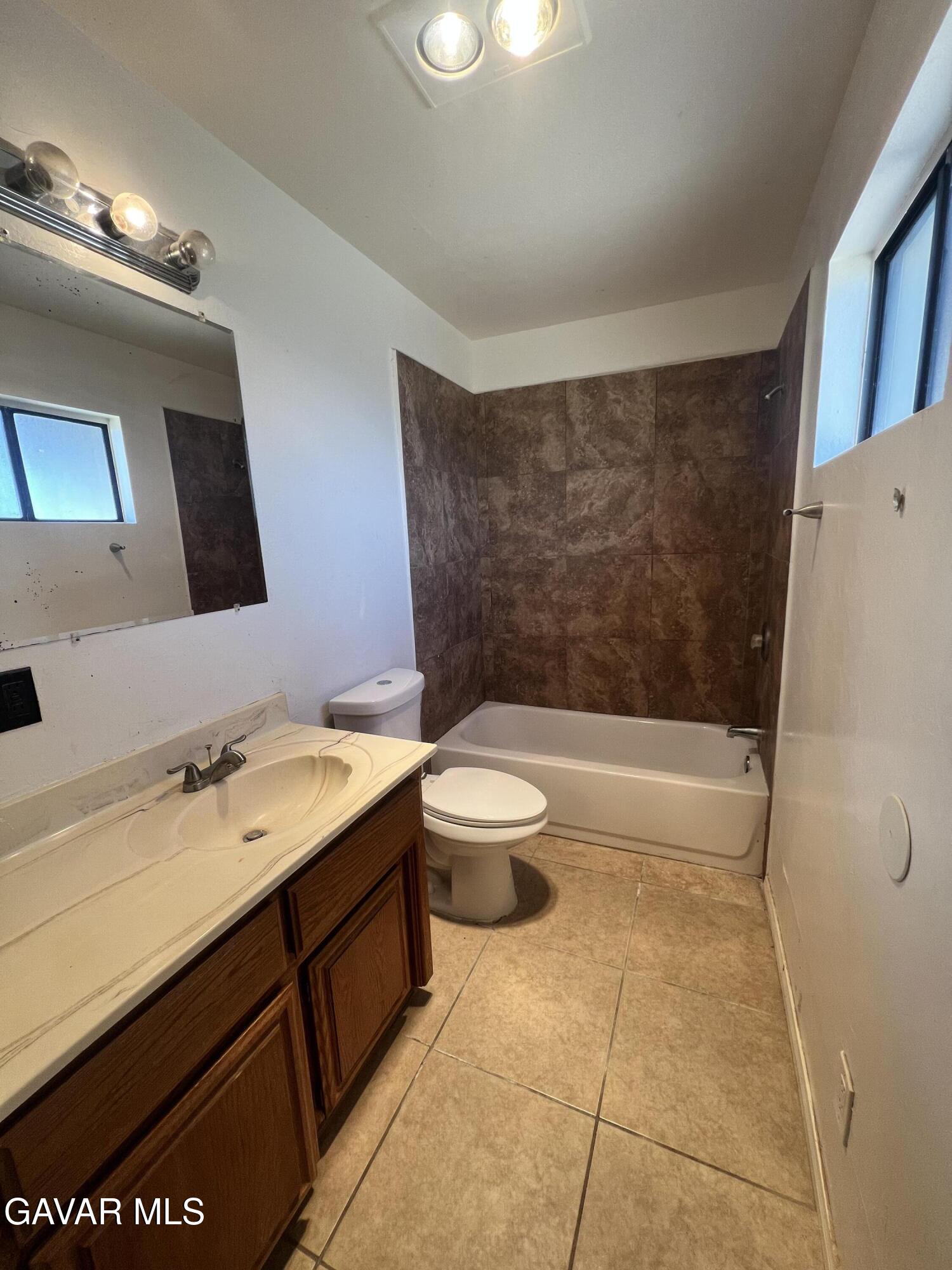 13632 Fran Street North Edwards, CA 93523 - Photo 15 of 18 a bathroom with a sink a toilet and shower