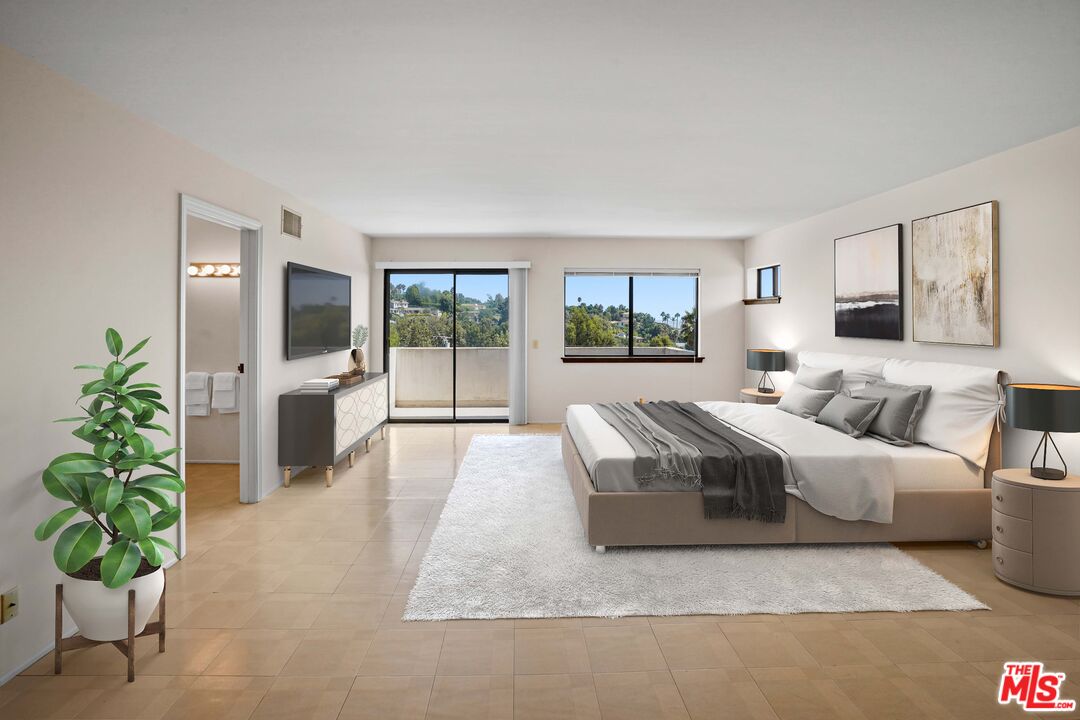 6405 Sycamore Meadows Drive Malibu, CA 90265 - Photo 11 of 26 a living room with furniture large window and flat screen tv