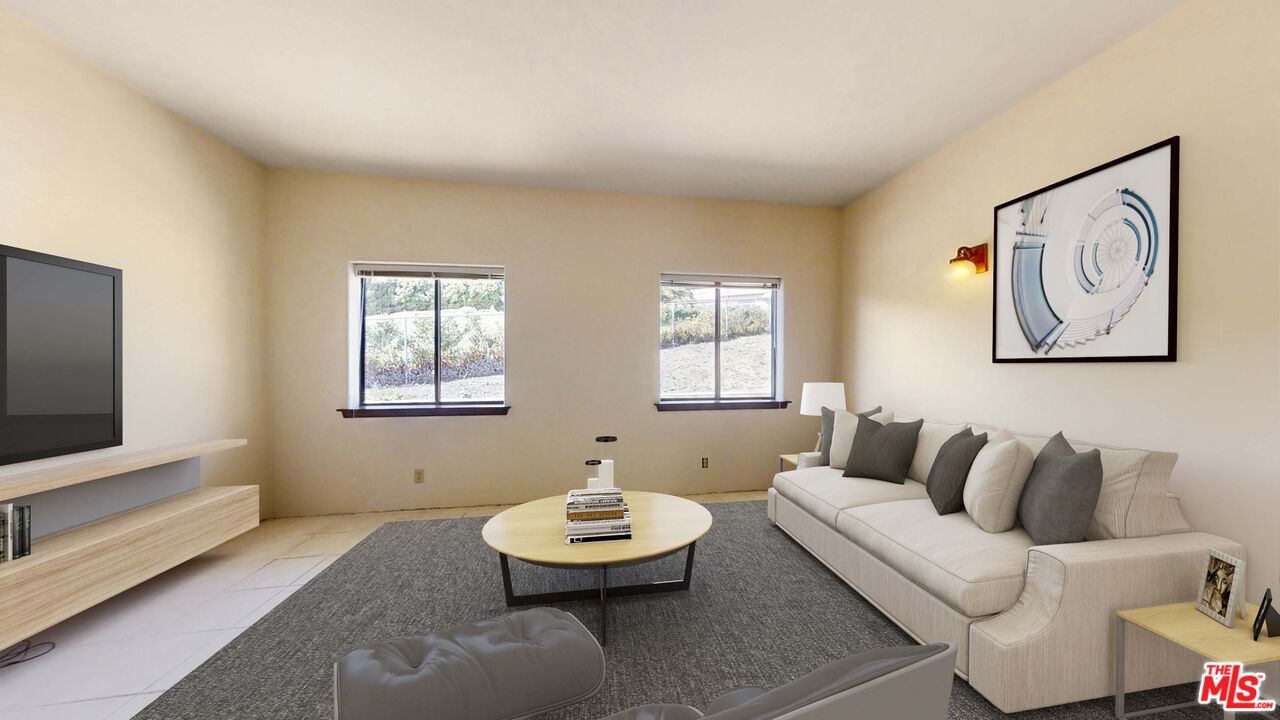 6405 Sycamore Meadows Drive Malibu, CA 90265 - Photo 15 of 26 a living room with furniture and a flat screen tv
