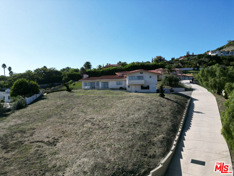 6405 Sycamore Meadows Drive Malibu, CA 90265 - Photo 25 of 26 a view of a house with a yard