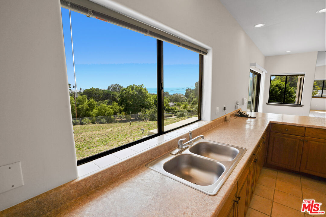 6405 Sycamore Meadows Drive Malibu, CA 90265 - Photo 8 of 26 a kitchen with a sink and a large window