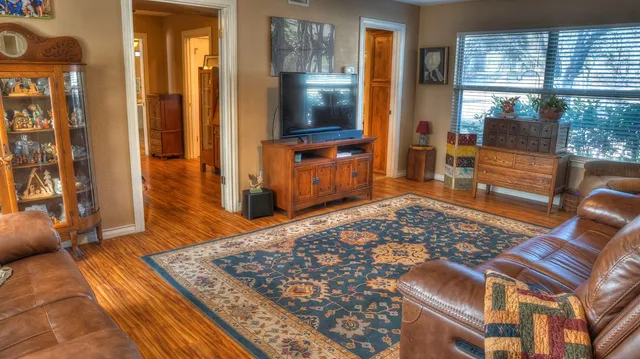 a view of balcony with wooden floor and furniture