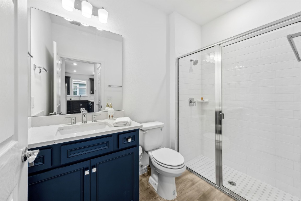540 Jubilee Circle Yulee, FL 32097 - Photo 19 of 42 a bathroom with a sink a toilet a mirror and shower