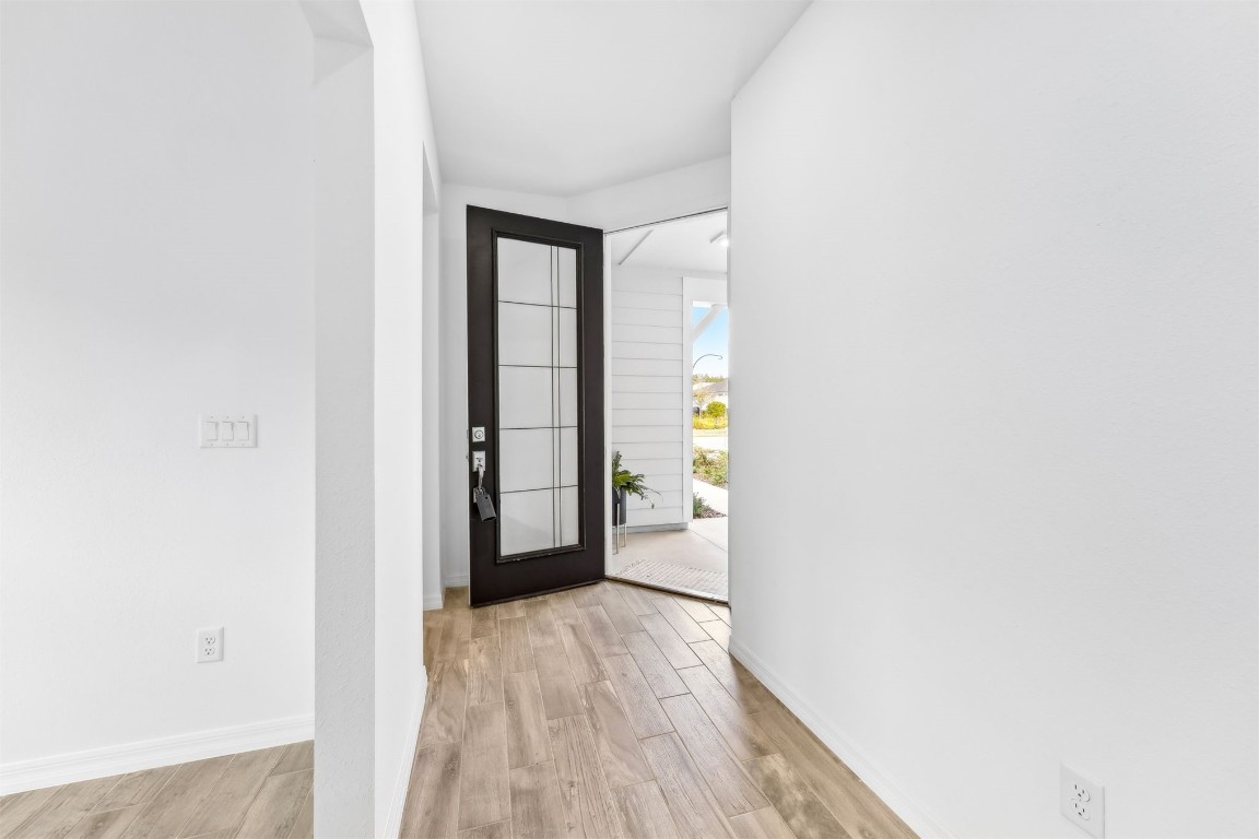 540 Jubilee Circle Yulee, FL 32097 - Photo 3 of 42 a view of a hallway with wooden floor