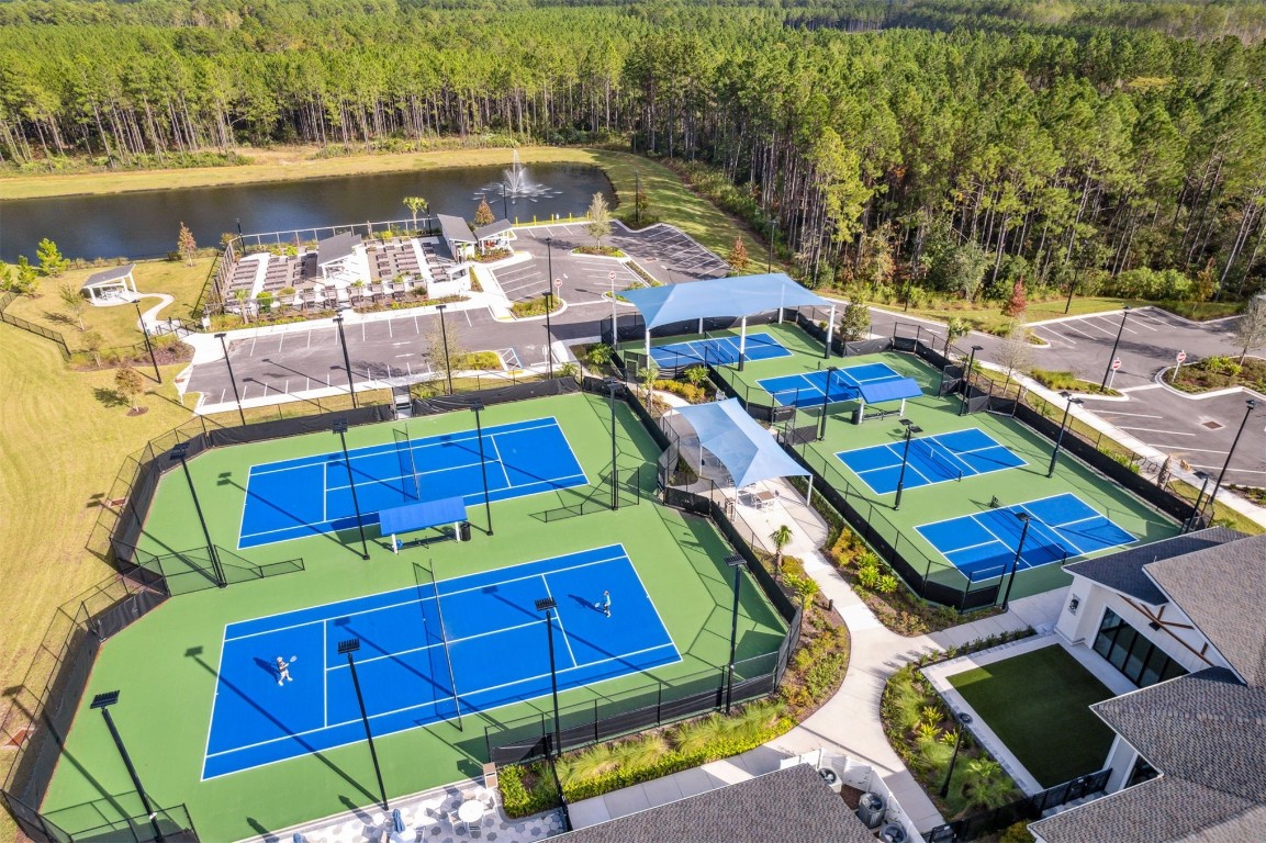 540 Jubilee Circle Yulee, FL 32097 - Photo 31 of 42 a aerial view of a swimming pool with outdoor seating and yard