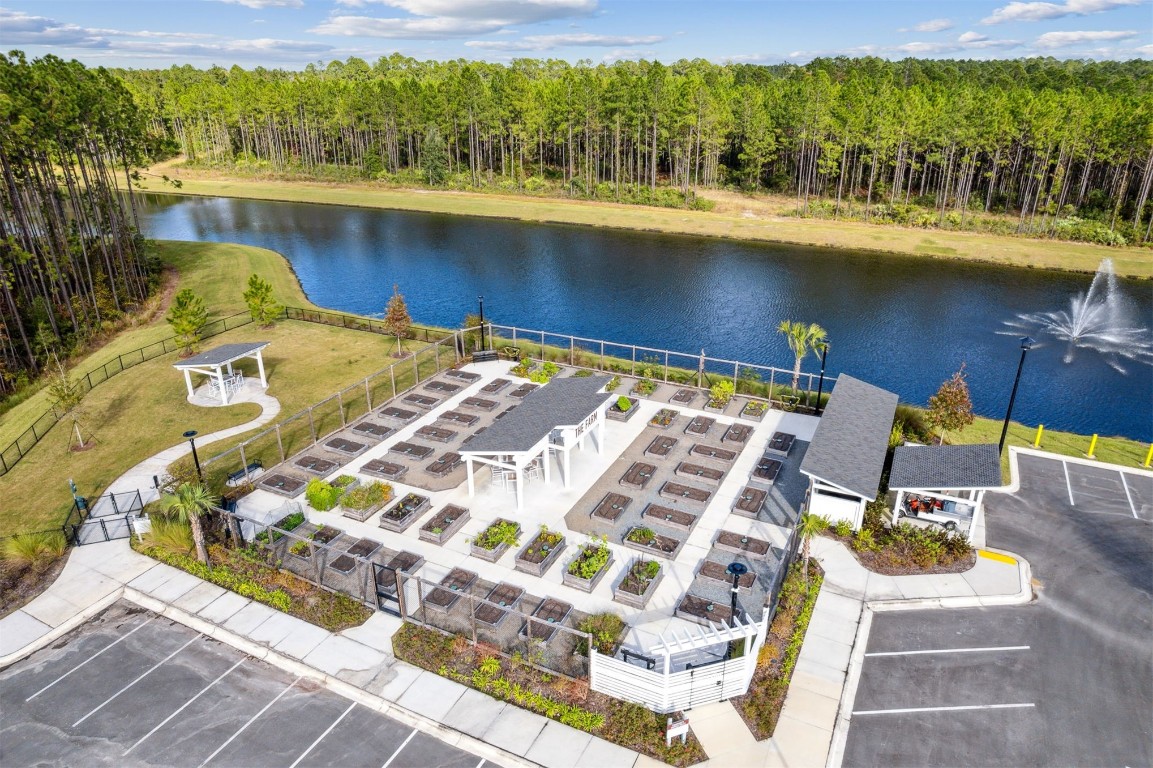 540 Jubilee Circle Yulee, FL 32097 - Photo 39 of 42 a view of swimming pool with seating area and trees in the background