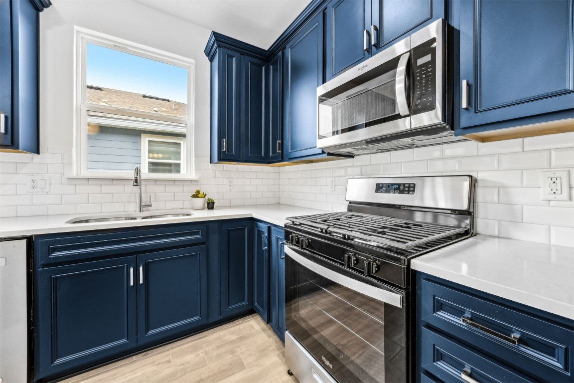 540 Jubilee Circle Yulee, FL 32097 - Photo 4 of 42 a kitchen with wooden cabinets and a stove top oven