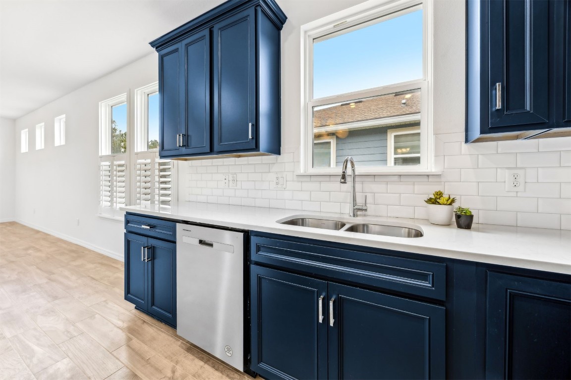540 Jubilee Circle Yulee, FL 32097 - Photo 6 of 42 a kitchen with stainless steel appliances granite countertop a sink and cabinets