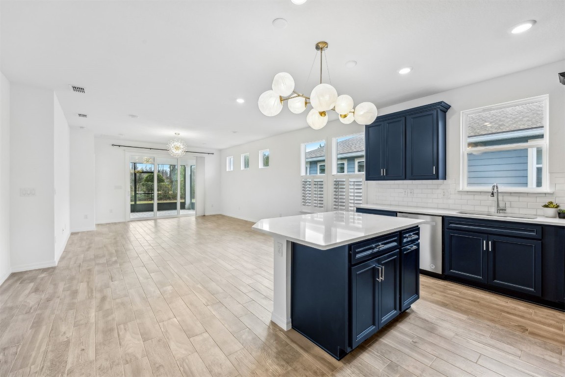 540 Jubilee Circle Yulee, FL 32097 - Photo 8 of 42 a kitchen that has a lot of cabinets and stainless steel appliances