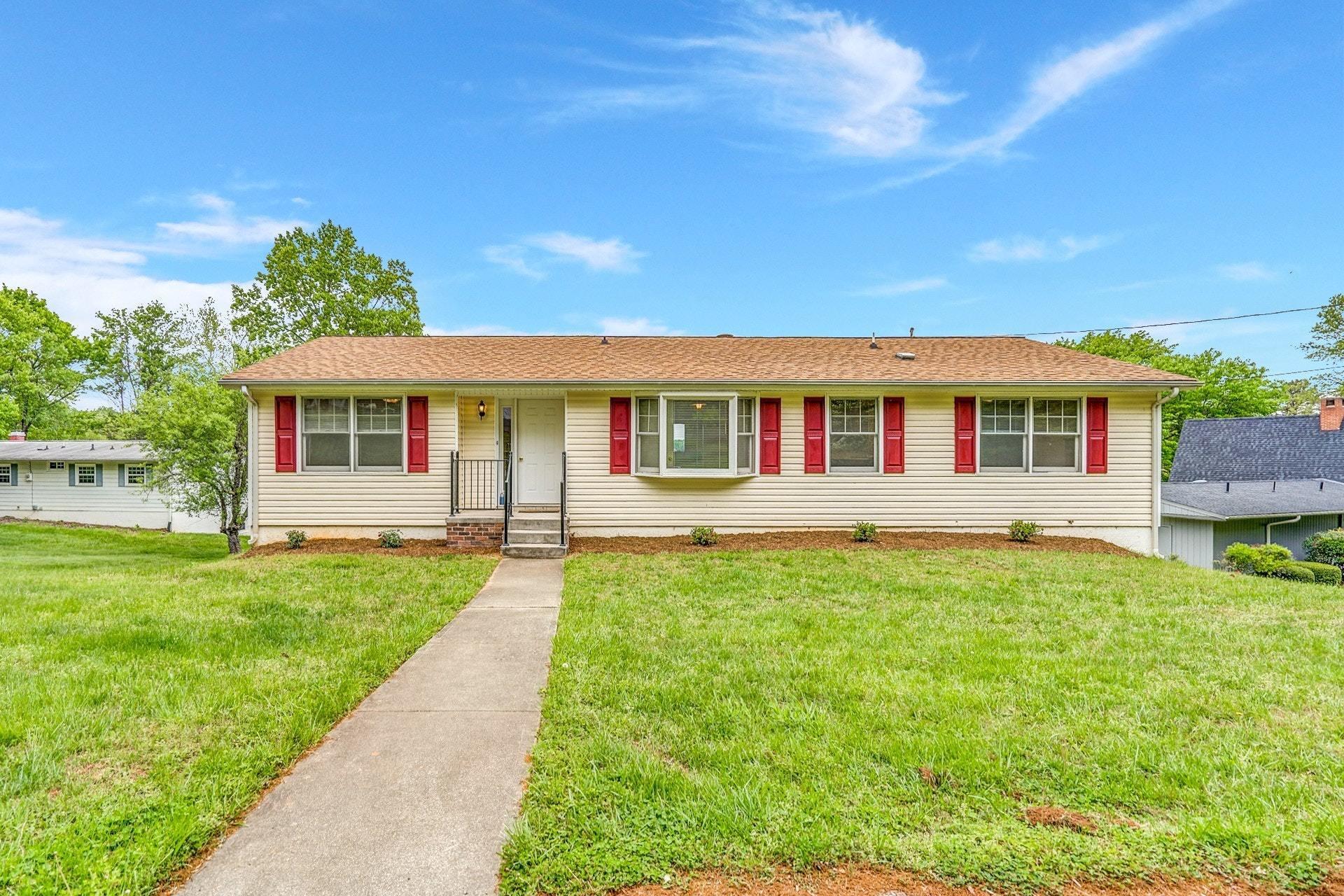 1047 Highland Lake Road Union Hall, VA 24176 - Photo 2 of 39 a front view of a house with a yard