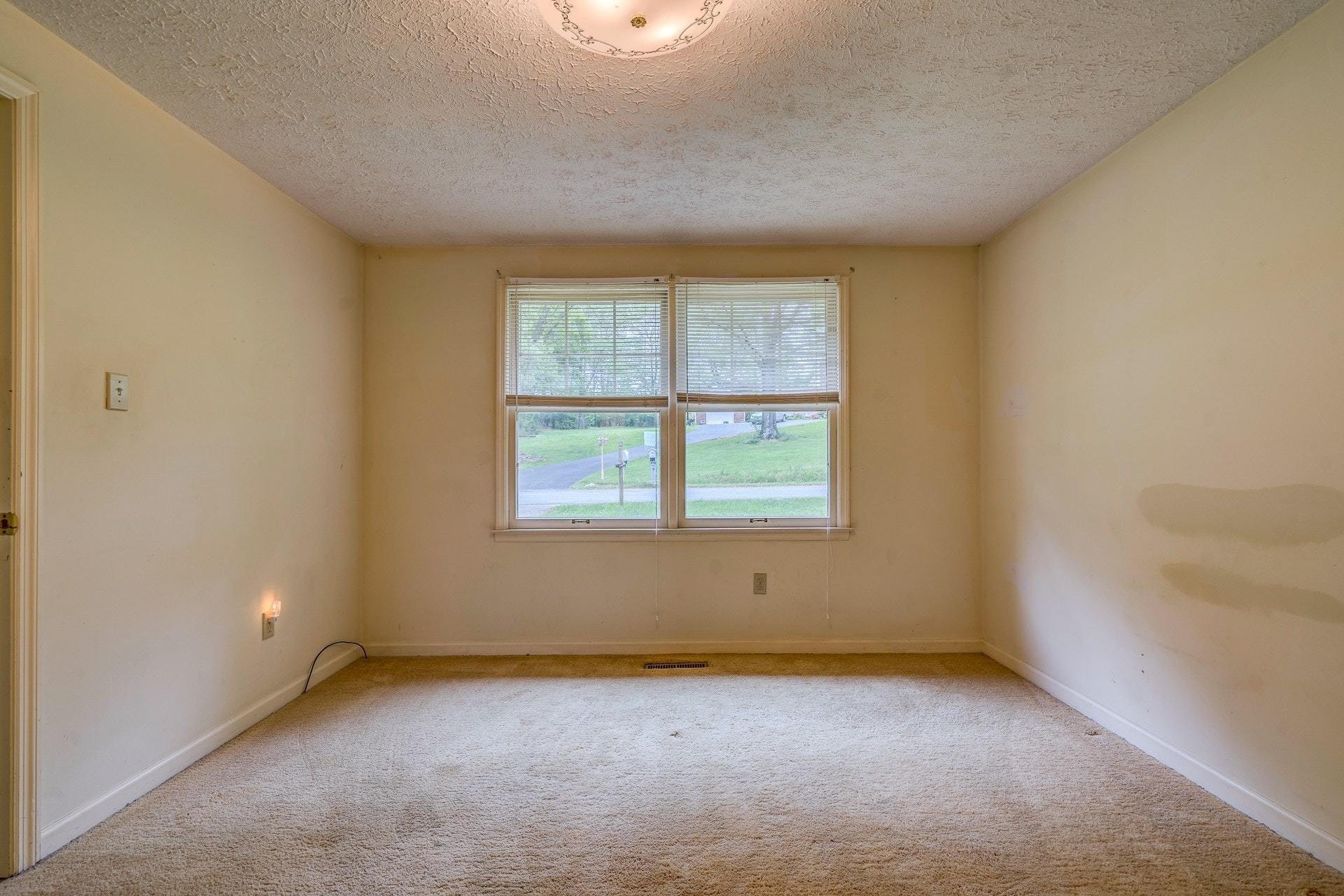 1047 Highland Lake Road Union Hall, VA 24176 - Photo 11 of 39 an empty room with a window