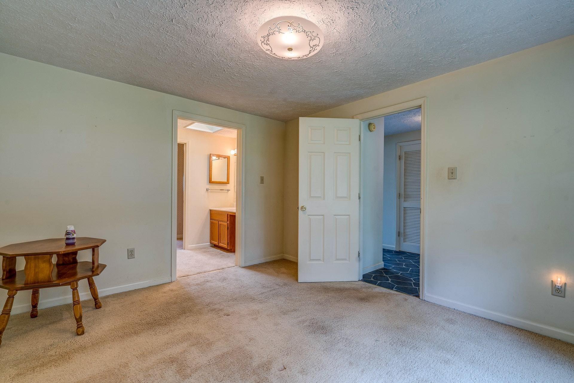 1047 Highland Lake Road Union Hall, VA 24176 - Photo 12 of 39 a view of a room with workspace and windows