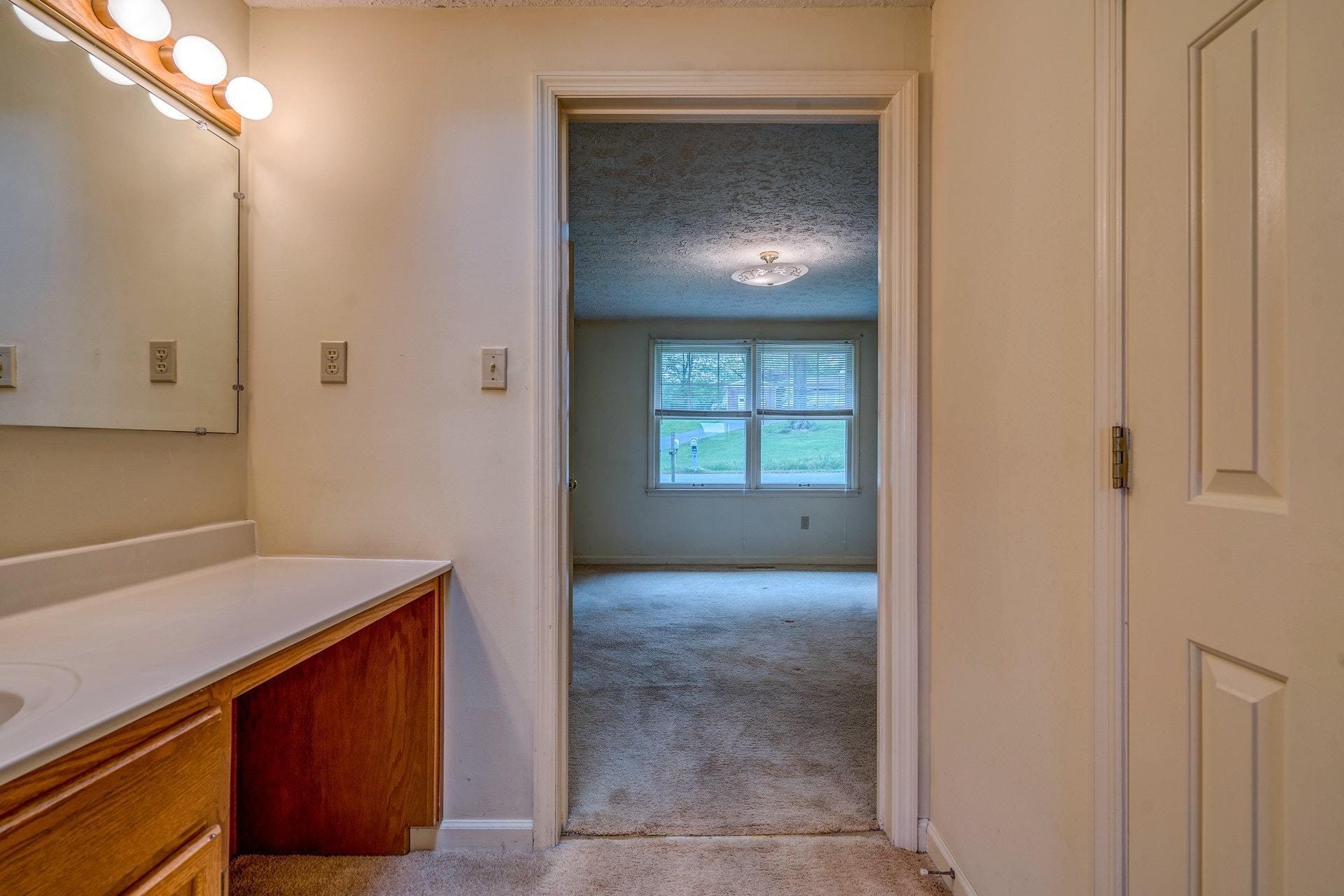 1047 Highland Lake Road Union Hall, VA 24176 - Photo 14 of 39 a view of a hallway to an empty room and a window
