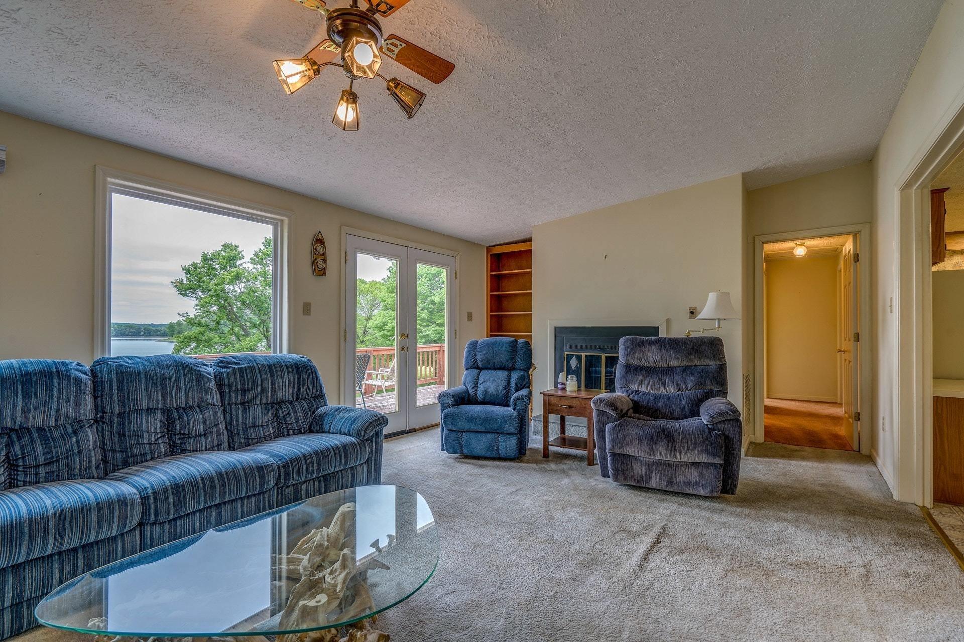 1047 Highland Lake Road Union Hall, VA 24176 - Photo 16 of 39 a living room with furniture and a large window