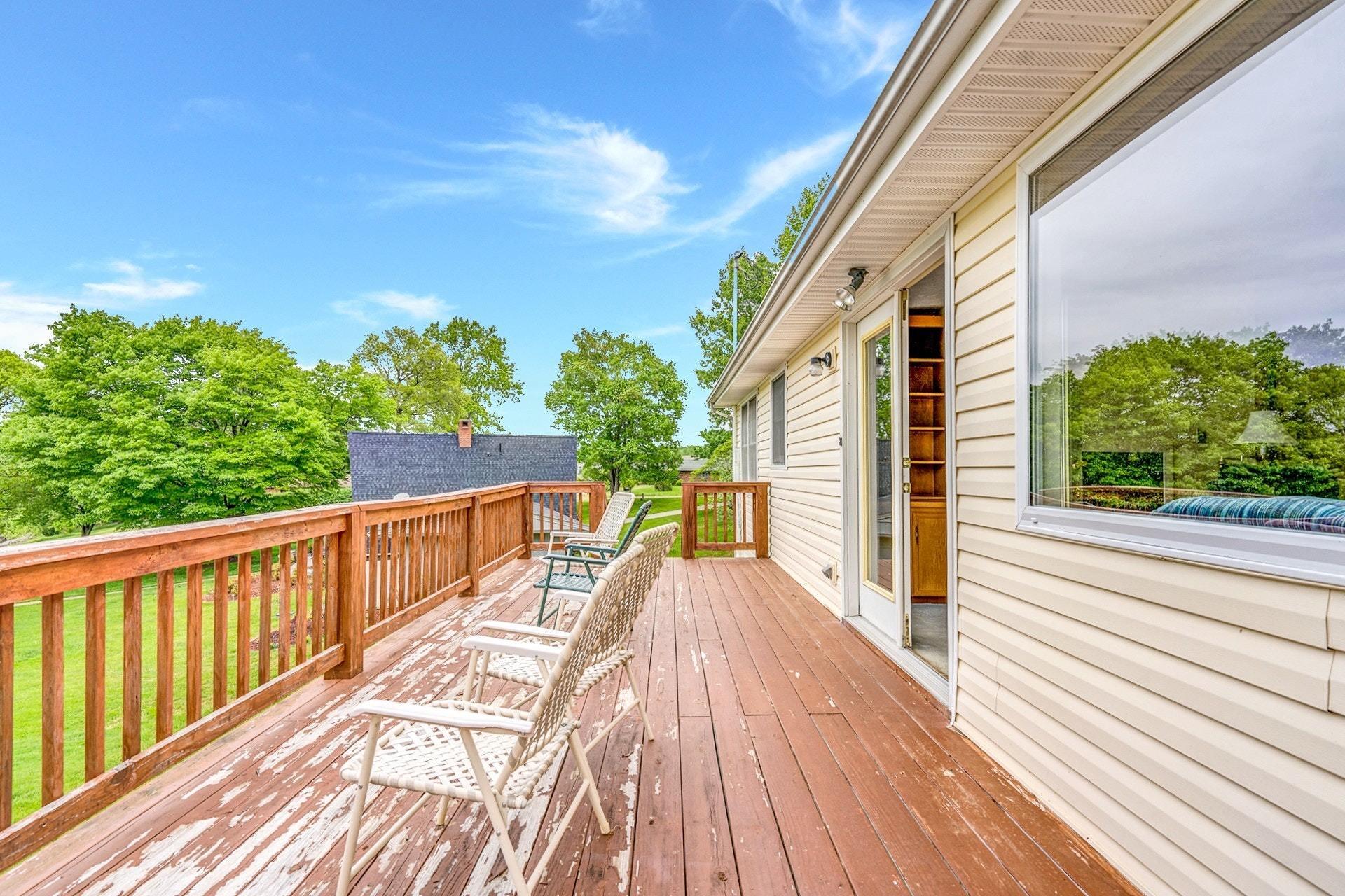 1047 Highland Lake Road Union Hall, VA 24176 - Photo 20 of 39 a view of balcony with wooden floor and fence