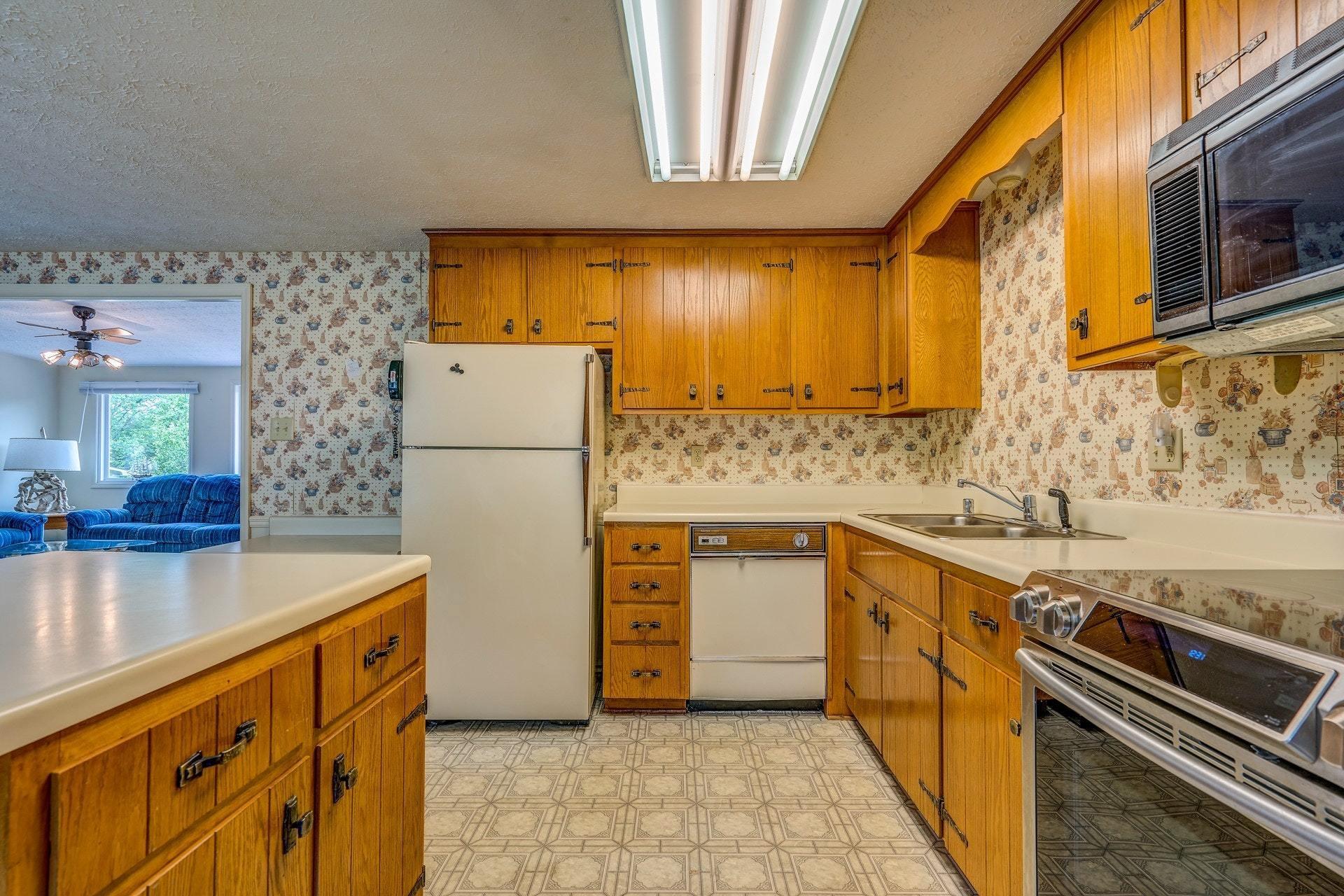 1047 Highland Lake Road Union Hall, VA 24176 - Photo 24 of 39 a kitchen with stainless steel appliances a stove a sink and a refrigerator