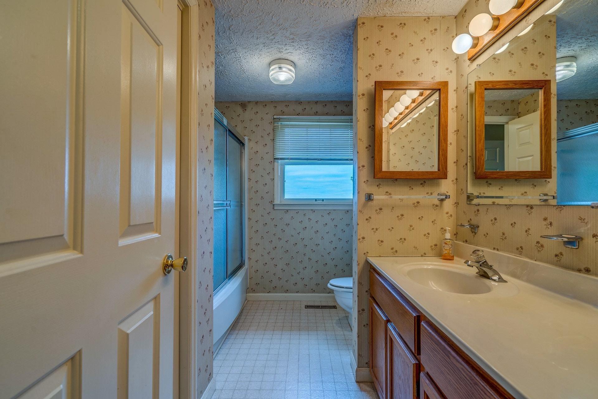 1047 Highland Lake Road Union Hall, VA 24176 - Photo 25 of 39 a bathroom with a sink a toilet and shower