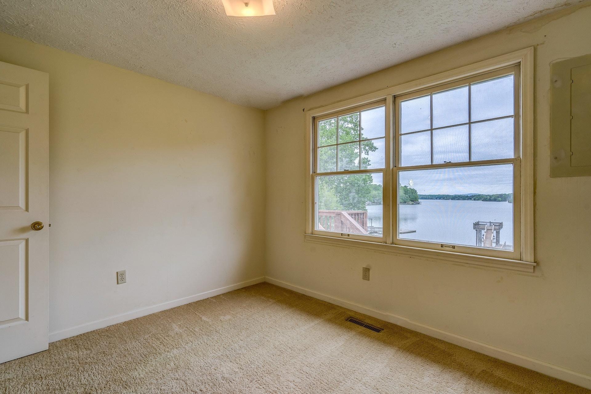 1047 Highland Lake Road Union Hall, VA 24176 - Photo 27 of 39 an empty room with a window