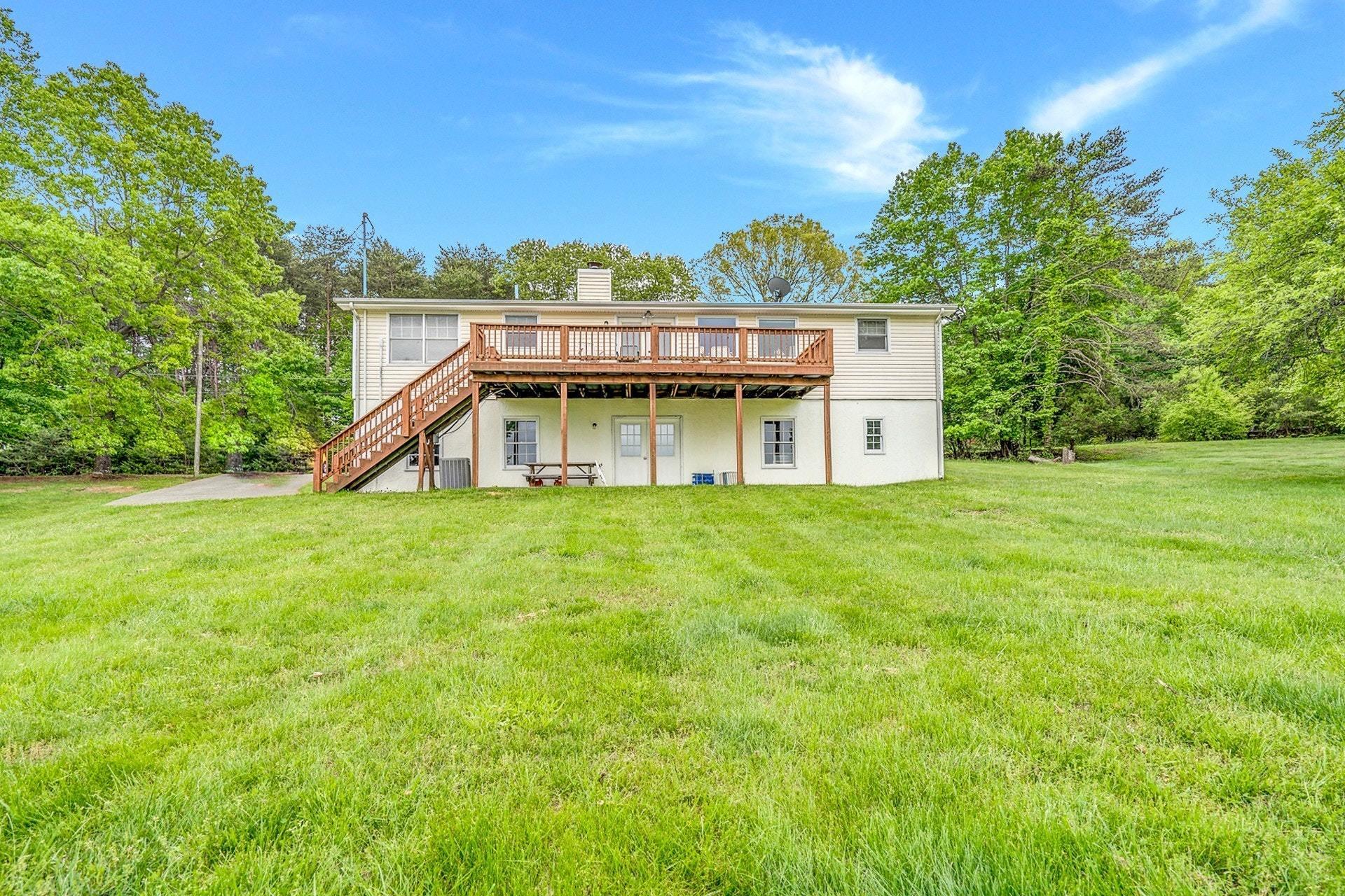 1047 Highland Lake Road Union Hall, VA 24176 - Photo 32 of 39 a house with a garden
