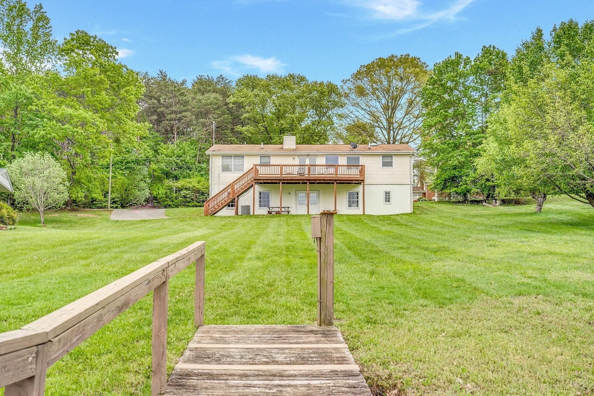 1047 Highland Lake Road Union Hall, VA 24176 - Photo 34 of 39 a view of a house with a yard