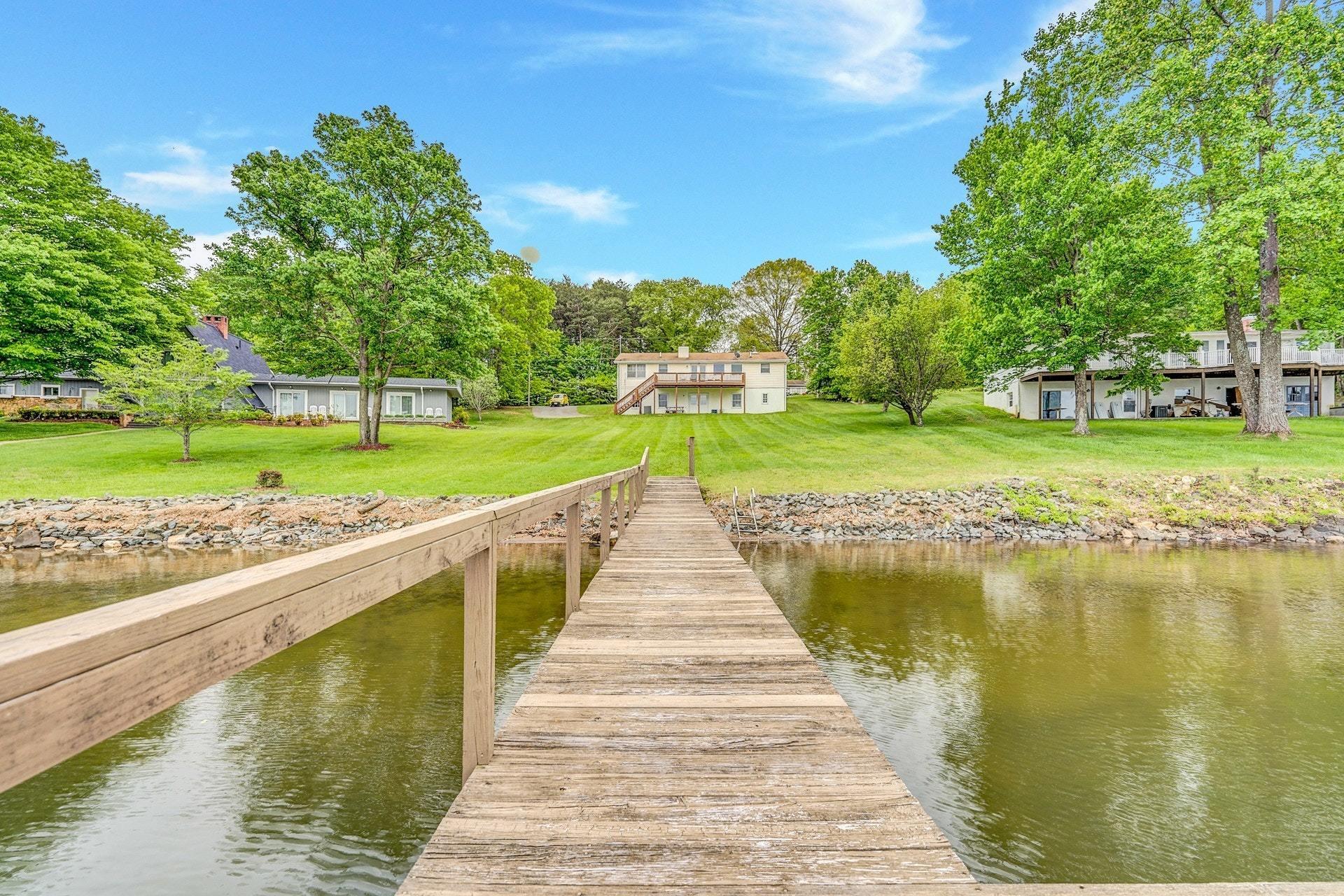 1047 Highland Lake Road Union Hall, VA 24176 - Photo 5 of 39 a view of a lake with a big yard