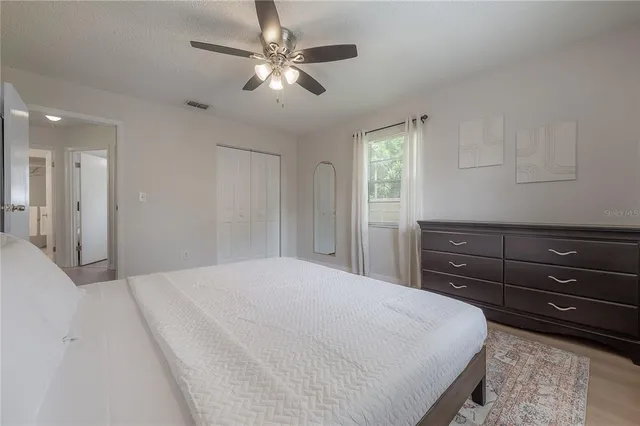 a bathroom with a toilet tub and shower