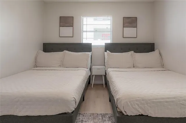 a bedroom with bed and a window