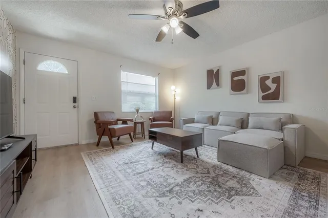 a living room with furniture and a window