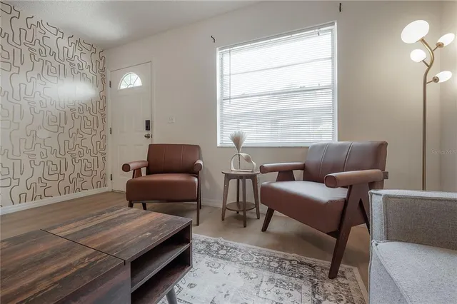 a living room with furniture and a window