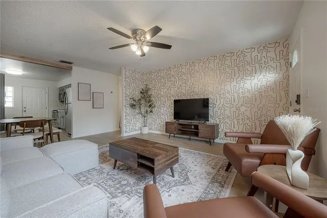 a living room with furniture and a flat screen tv