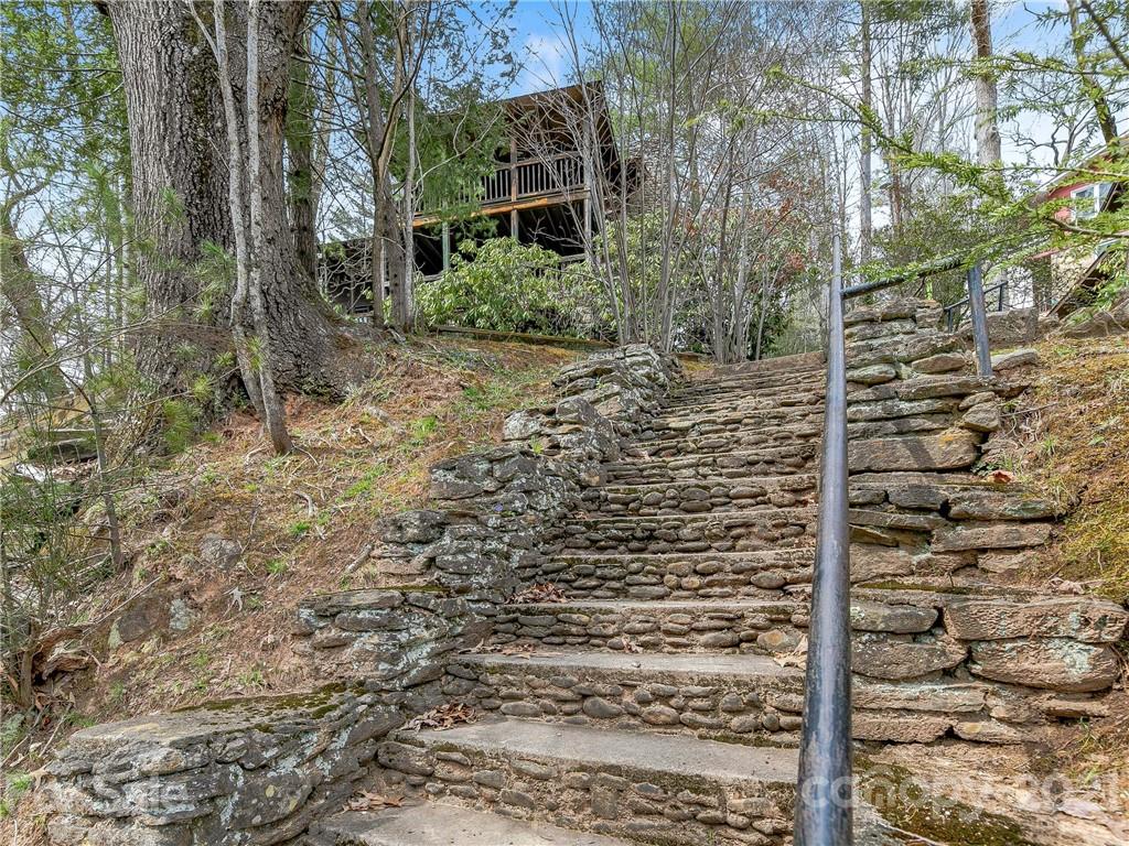 837 County Road Waynesville, NC 28785 - Photo 22 of 23 a brick building with a yard