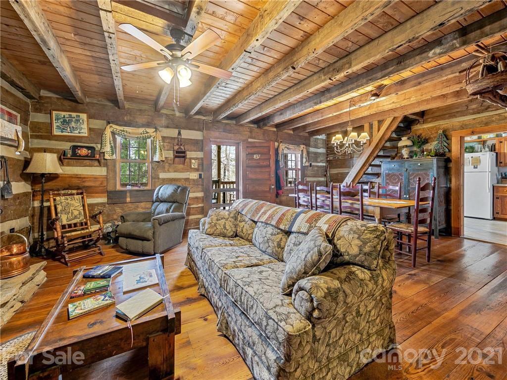 837 County Road Waynesville, NC 28785 - Photo 5 of 23 a living room with lots of furniture and a flat screen tv