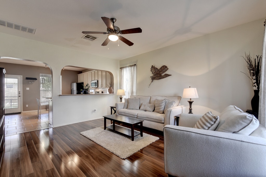2201 Keepsake Drive Austin, TX 78745 - Photo 5 of 25 a living room with furniture and a wooden floor