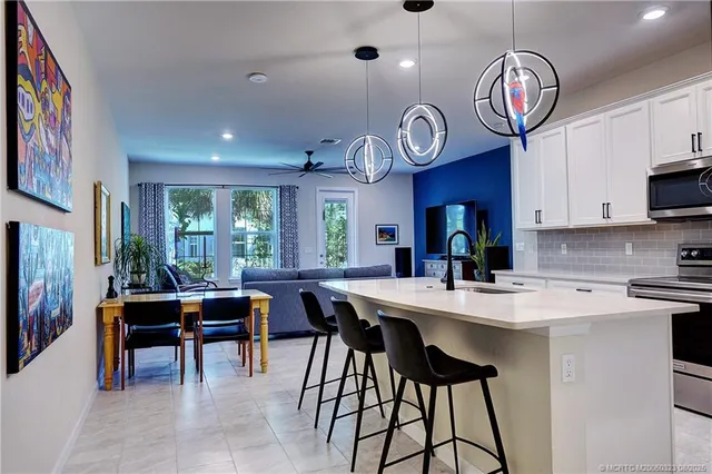a view of a dining area with furniture and a large window