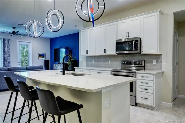 a kitchen with a dining table and chairs