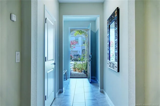 a view of an entryway with wooden floor