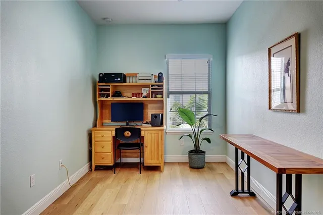 a room with furniture and a wooden floor