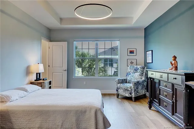 a bedroom with furniture and a window