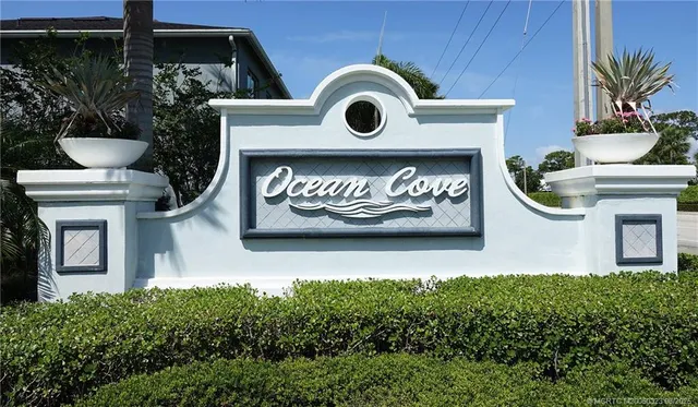 a view of outdoor space with signage and flags
