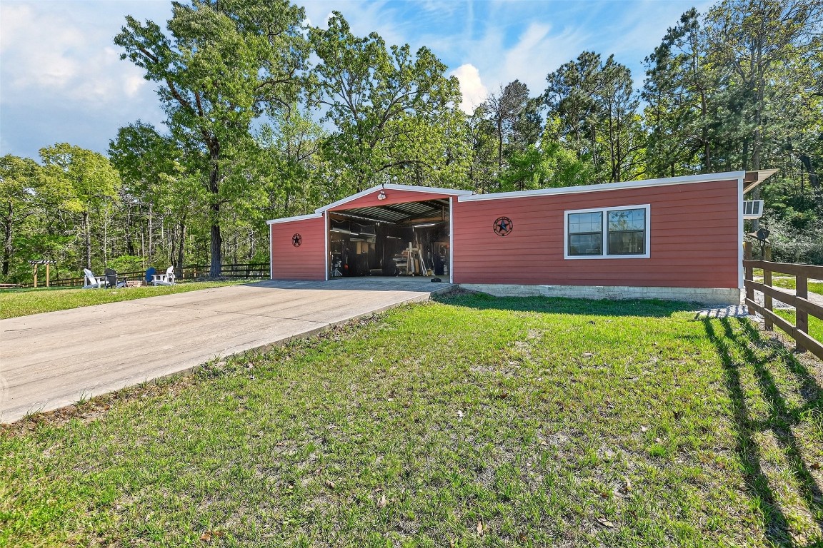299 North Ghost Branch Road Trinity, TX 75862 - Photo 26 of 48 60x40 shop with additional guest quarters. Guest house includes full kitchen and bathroom