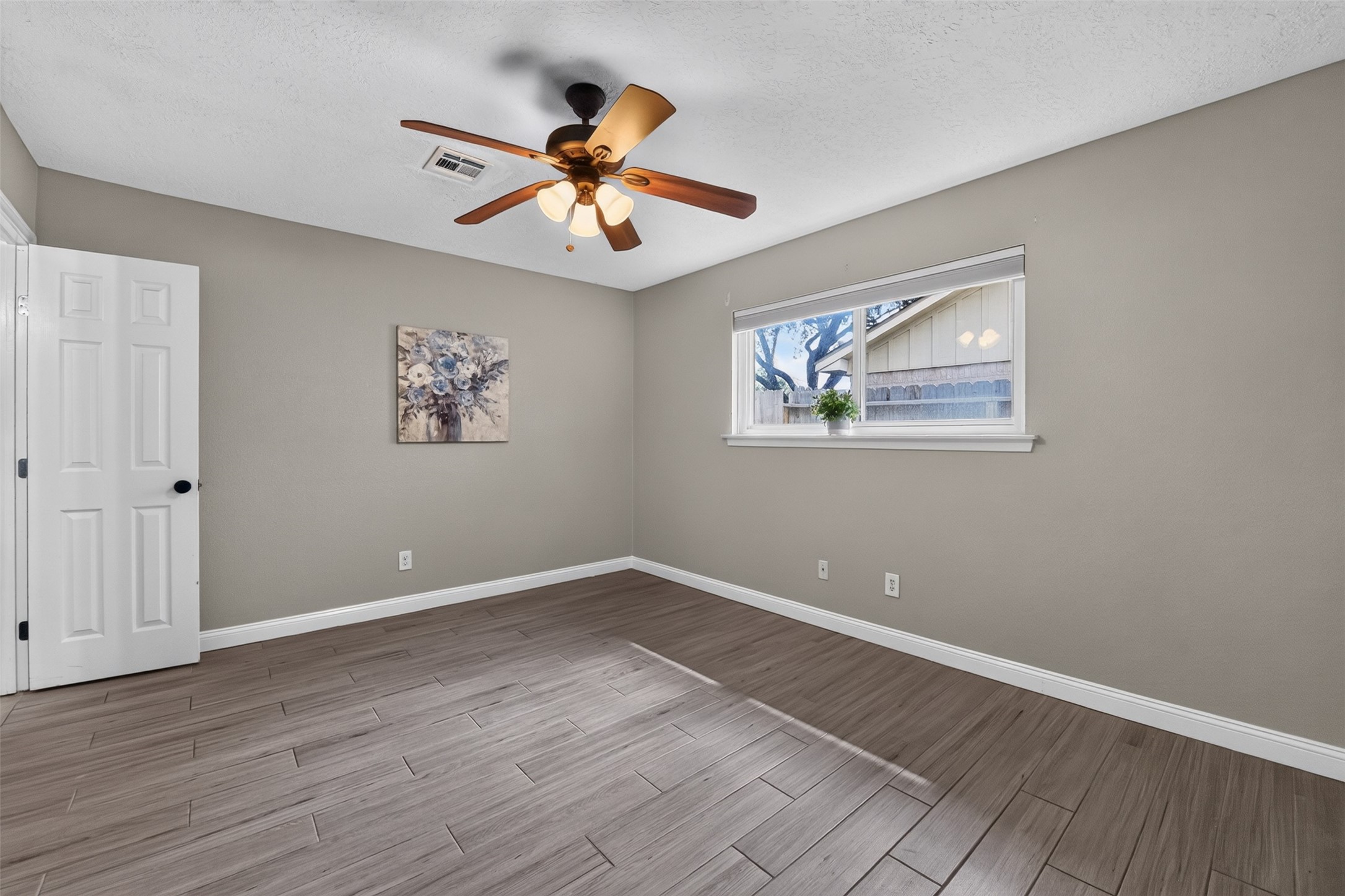 10407 Winding Trail Road La Porte, TX 77571 - Photo 20 of 40 Relaxing primary suite featuring generous space, updated flooring, and abundant natural light