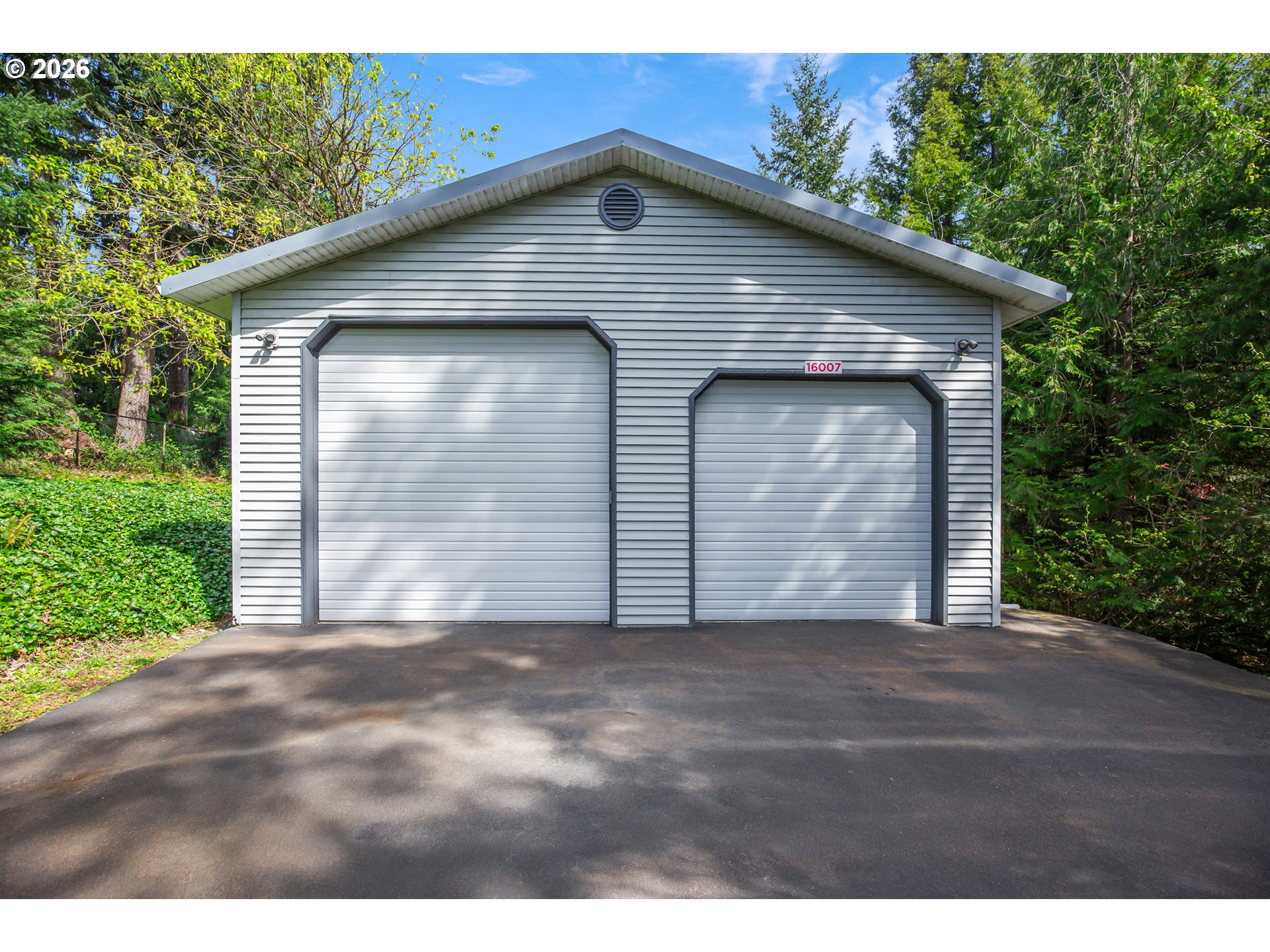 16007 Southeast Monner Road Happy Valley, OR 97086 - Photo 7 of 14 a front view of a house with a garage