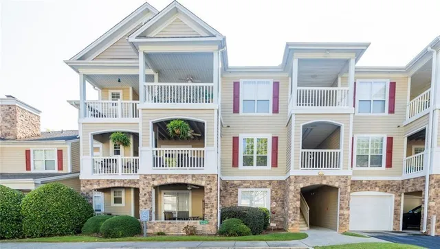 a front view of residential houses with yard