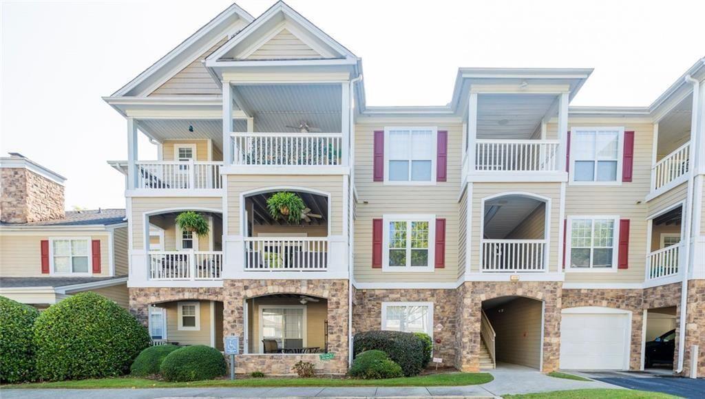 a front view of residential houses with yard